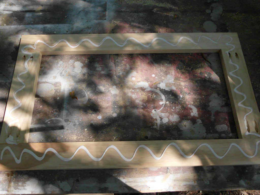 how to make DIY art with wallpaper apply glue to the frame