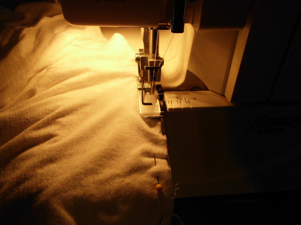 How to Give a Dress a Makeover sewing the new top on the skirt with a serger