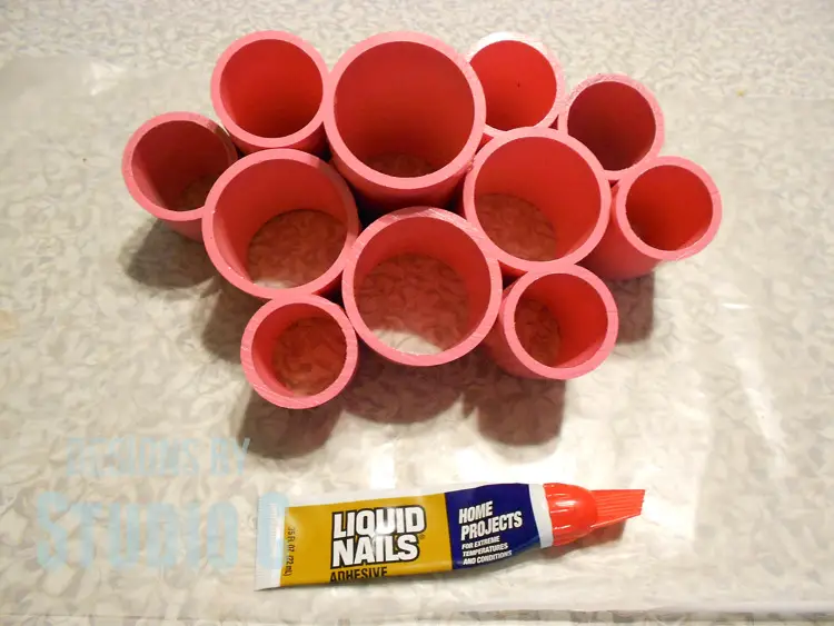 make desk organizing cups with pvc pieces arranged and glued together