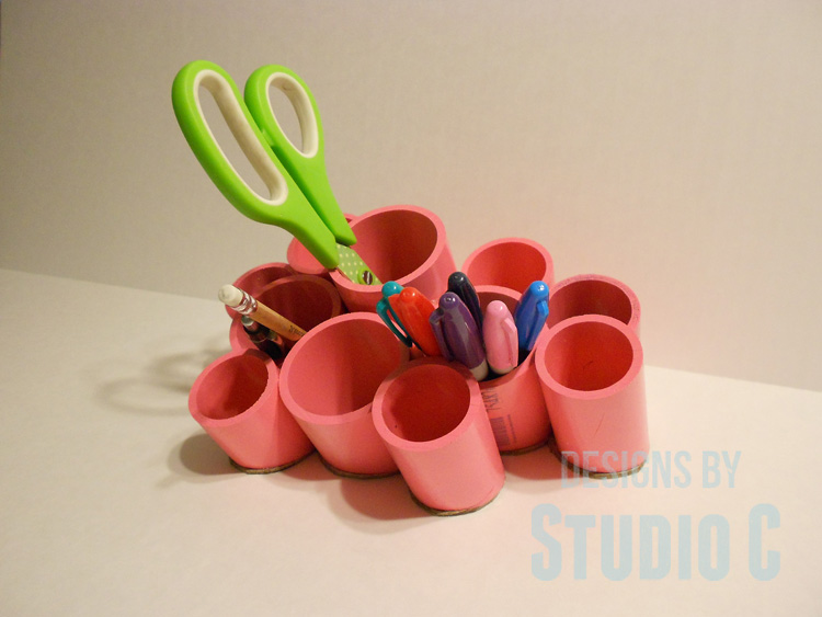make desk organizing cups with pvc finished project with green scissors