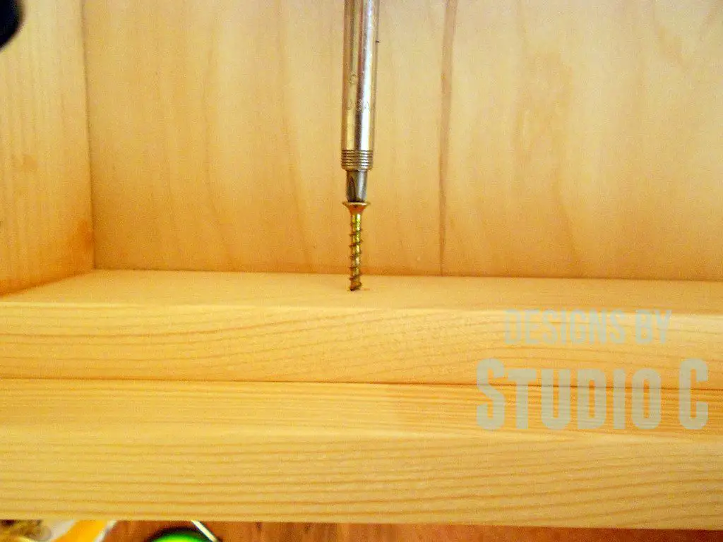 Easy Way to Install Drawer Fronts driving screws inside