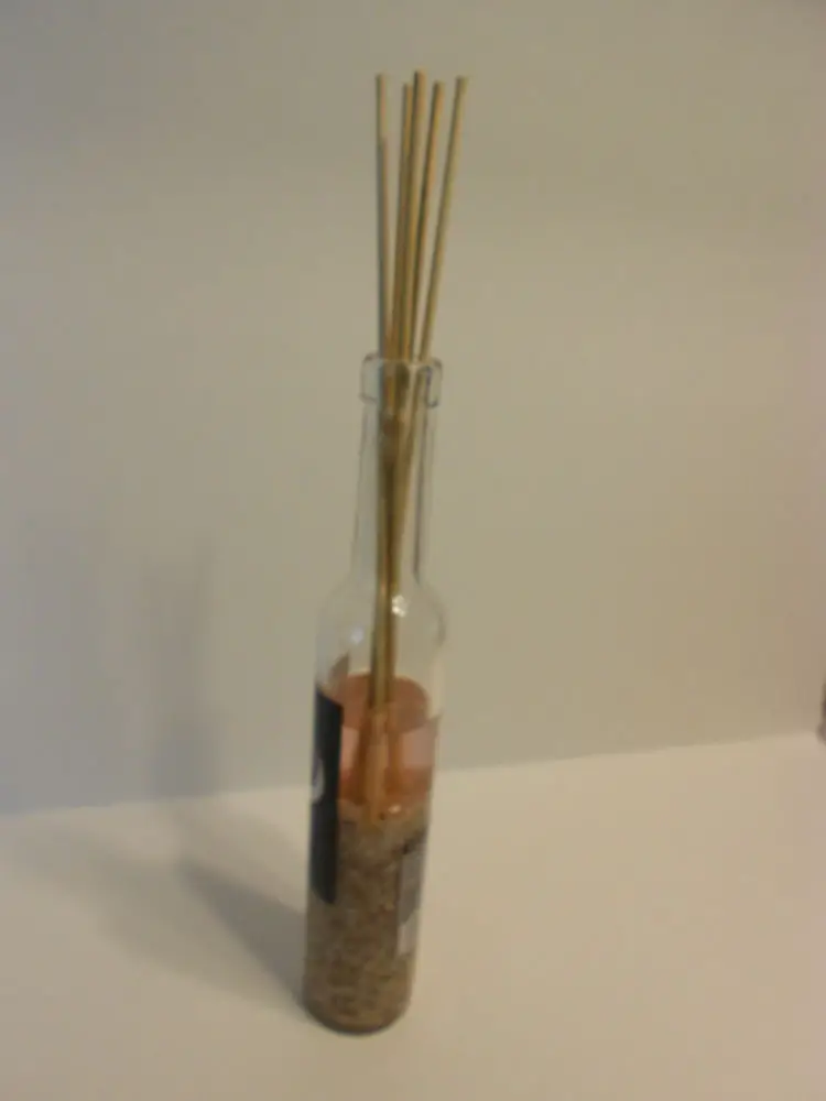 How to Make a Fragrance Diffuser with a Wine Bottle add diffuser oil and skewers