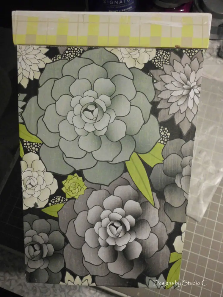 How to Give an Old Wastebasket a Makeover apply coordinating paper design