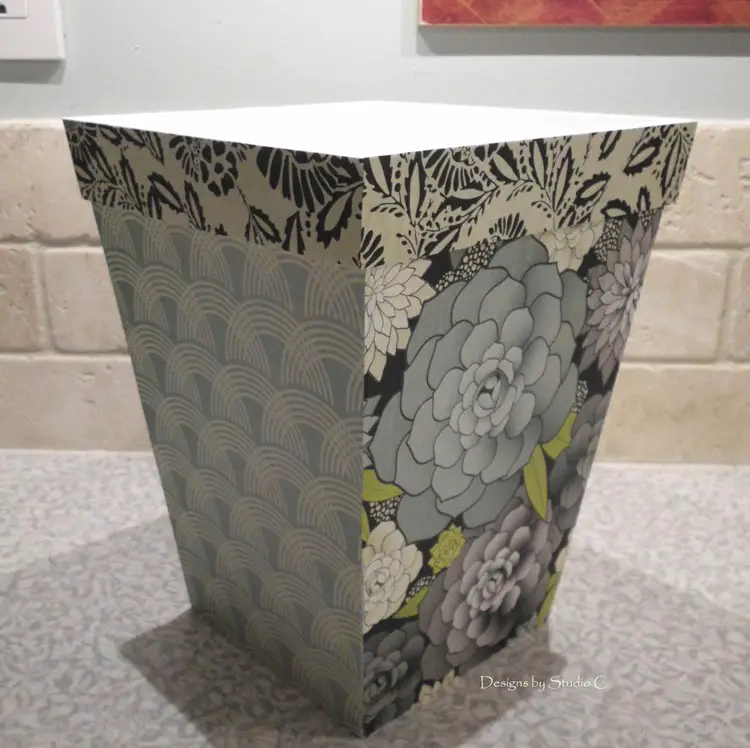 How to Give an Old Wastebasket a Makeover apply a third coordinated design to the top