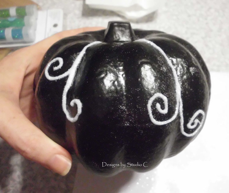 dollar store halloween pumpkin draw curls with glue and add glitter