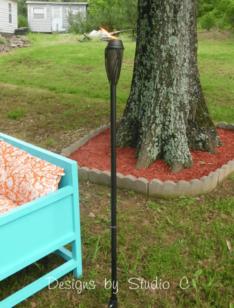 Backyard transformation ideas tiki torch by outdoor furniture and tree