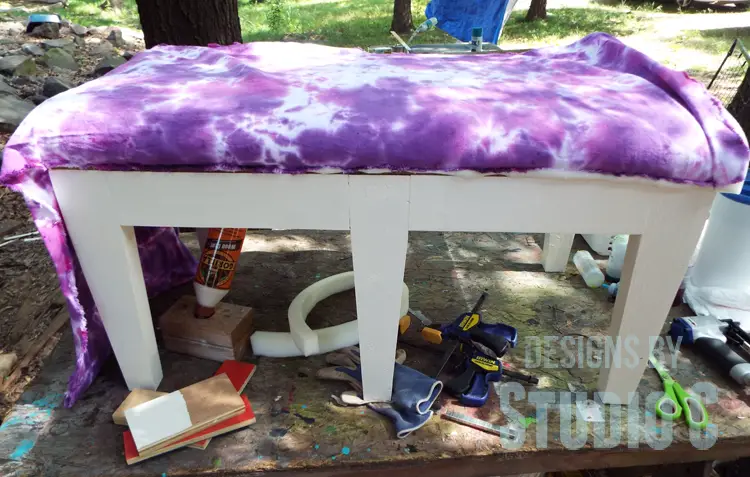 Tie Dye Fabric for an Upholstered Bench Seat securing fabric