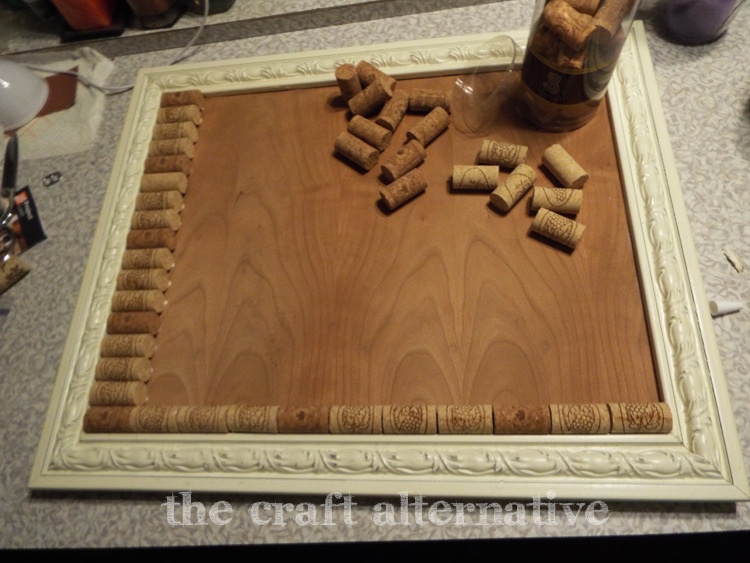 Making a Cork Board with Wine Corks gluing corks in frame