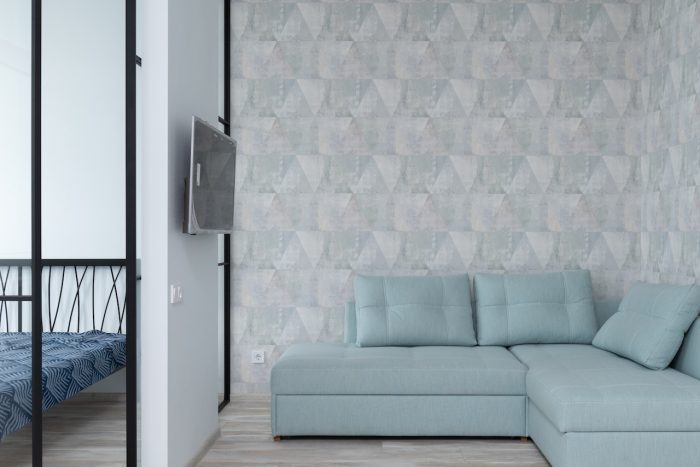 tips for choosing wallpaper blue sofa with print background