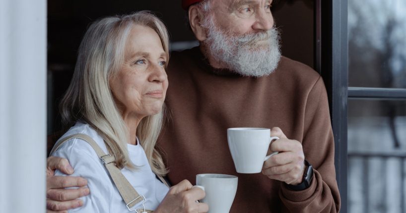 home modifications for the aging population couple with coffee mugs