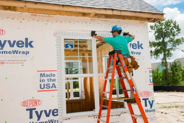 weatherization for the home construction worker applying Tyvek