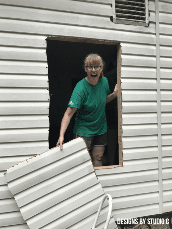 cutting opening installing window cutting away siding