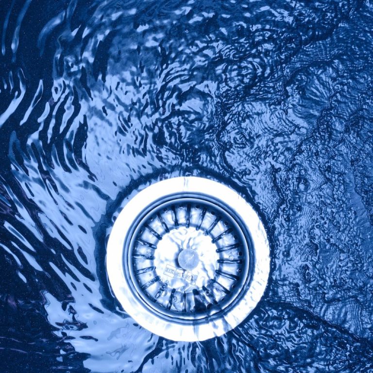 parts of a kitchen sink drain blue water