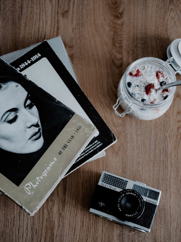 best coffee table books photography with camera and breakfast