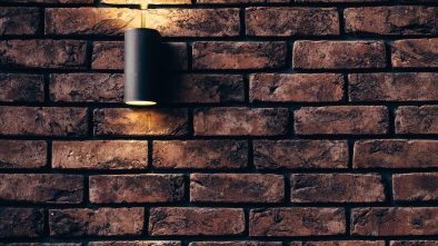 home lighting plan light on a brick wall