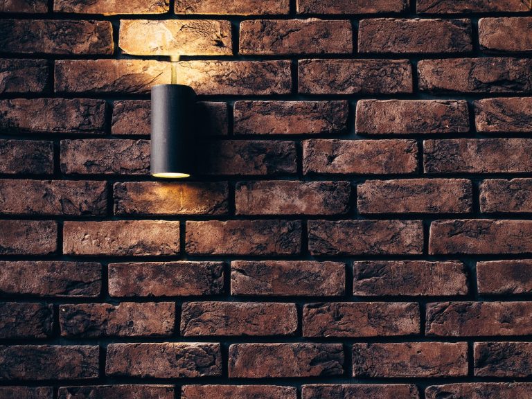 home lighting plan light on a brick wall