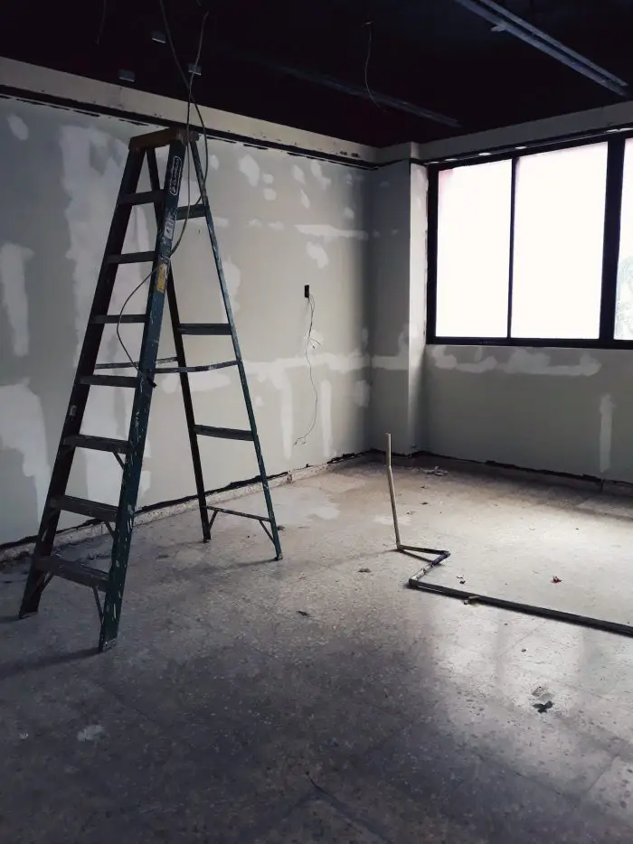 different types of ladders step ladder in unfinished room