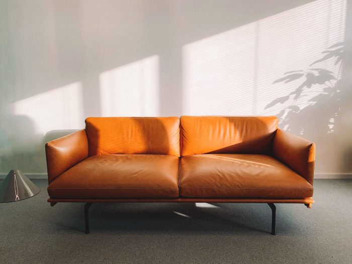 furniture for rental properties orange leather sofa