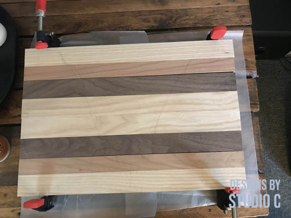 diy cutting board kit arranging pieces in a pattern