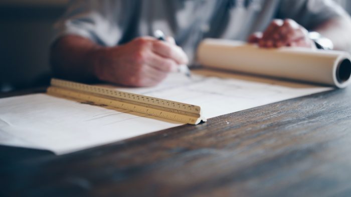 understanding home improvement permits regulations draftsman with ruler