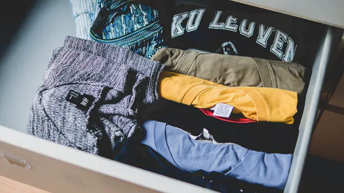 how to organize your closet clothing folded neatly in a drawer