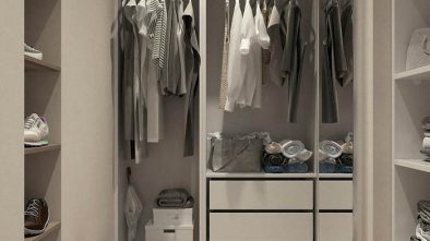 how to organize your closet featured image of neat and organized clothing