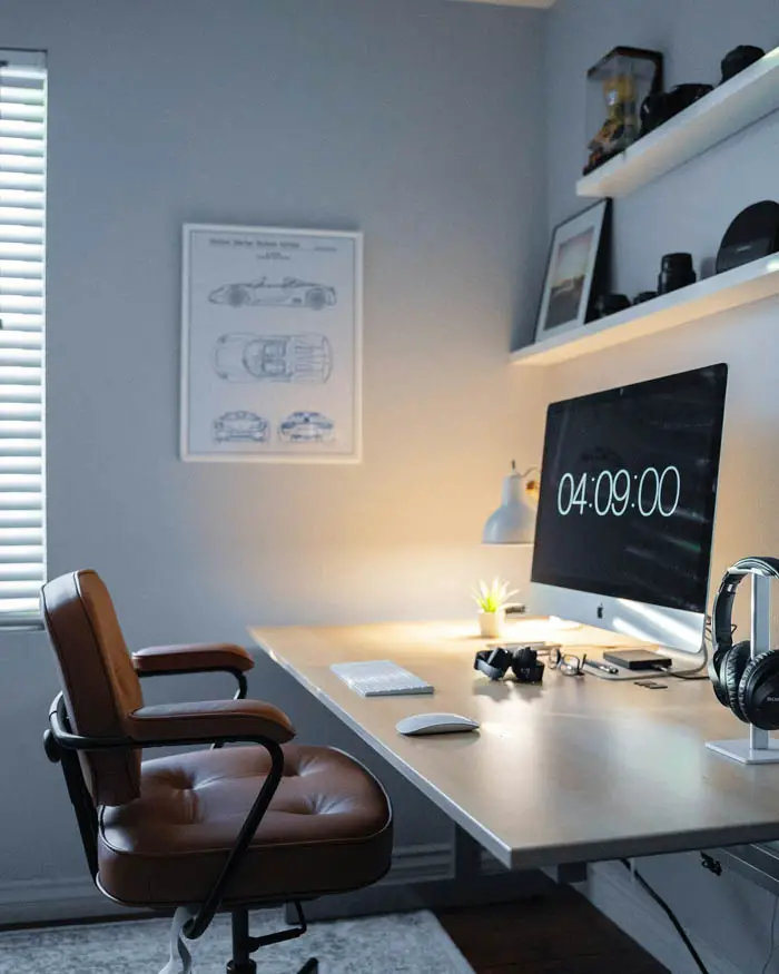 designing the perfect home office desk with large clock on computer screen