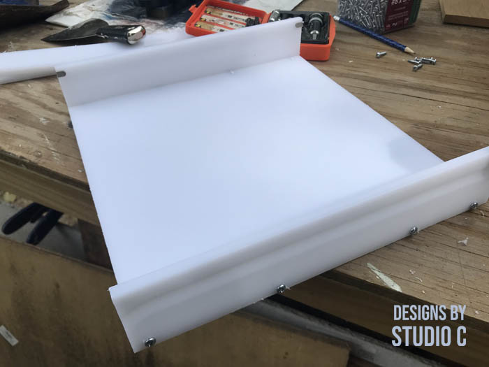 build a resin mold using plastic cutting boards sides secured with screws