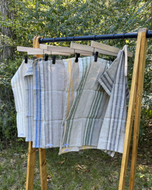 natural linen dish towels on hanging rack