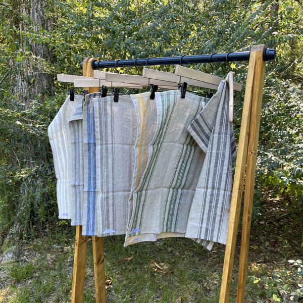 natural linen dish towels on hanging rack