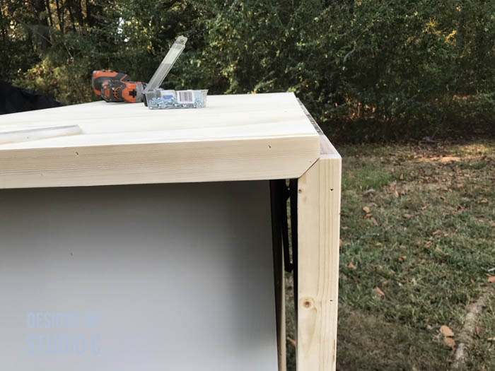 how to make a work table out of a base cabinet angling the side trim to fit