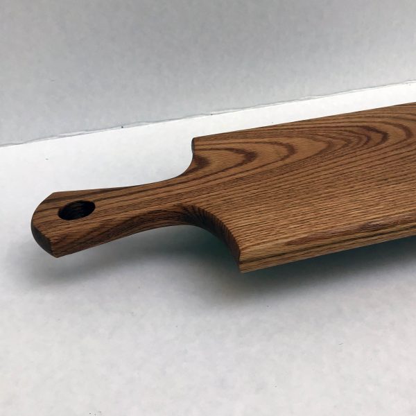 hardwood serving board with handle showing thickness of board