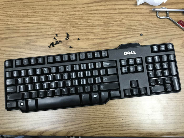 how to clean computer keyboard featured image with screws and keys