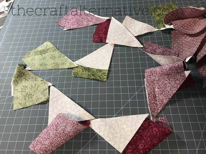 how to make a woven star quilt block sewing the triangles to the strips